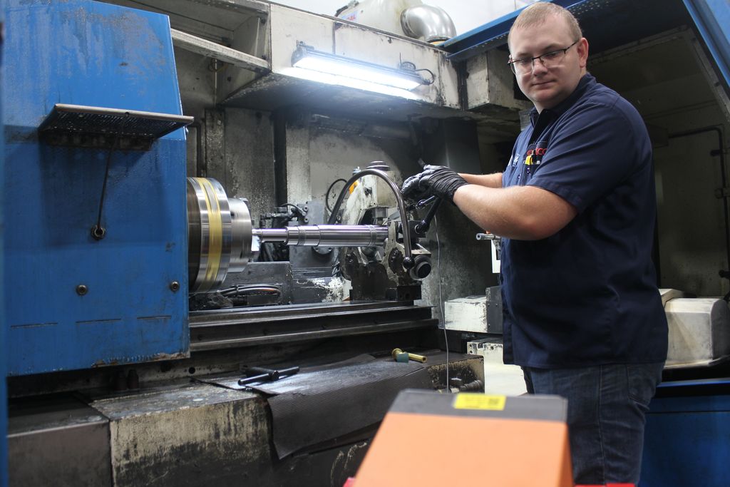 Setco worker repairing spindle